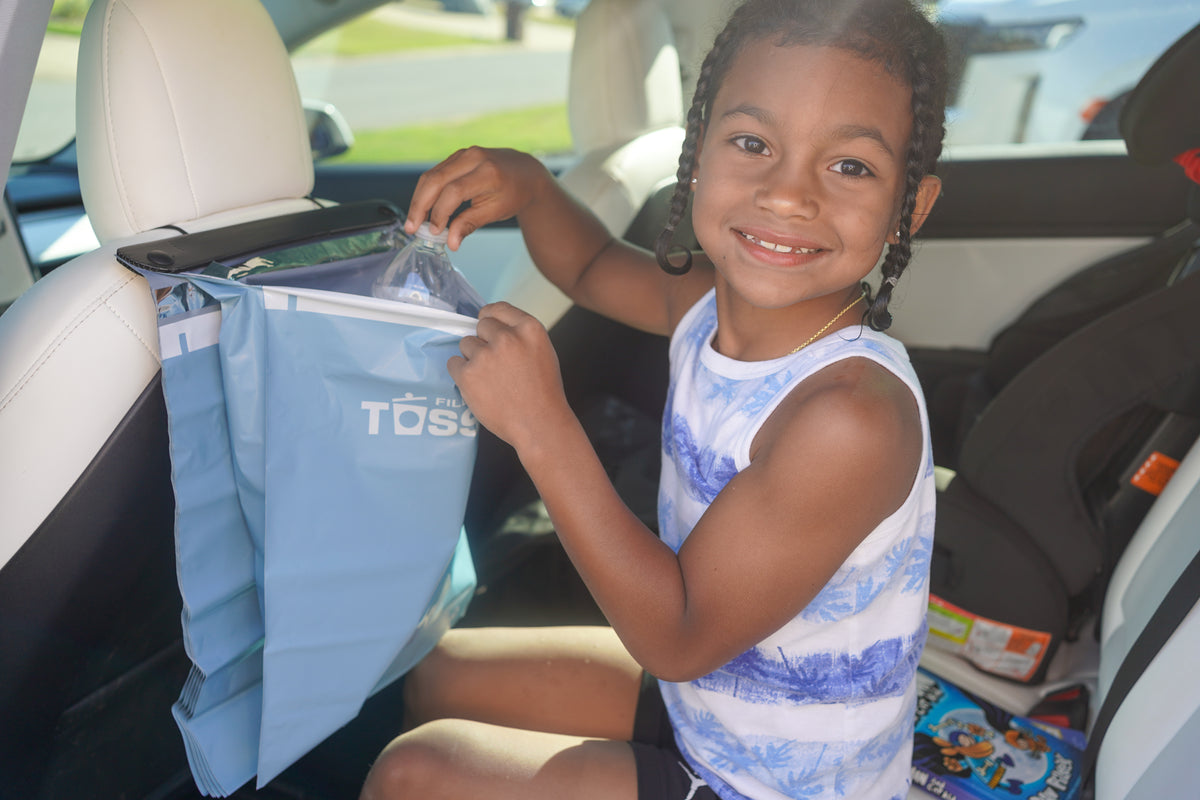 Tossits bag being filled from the back seat